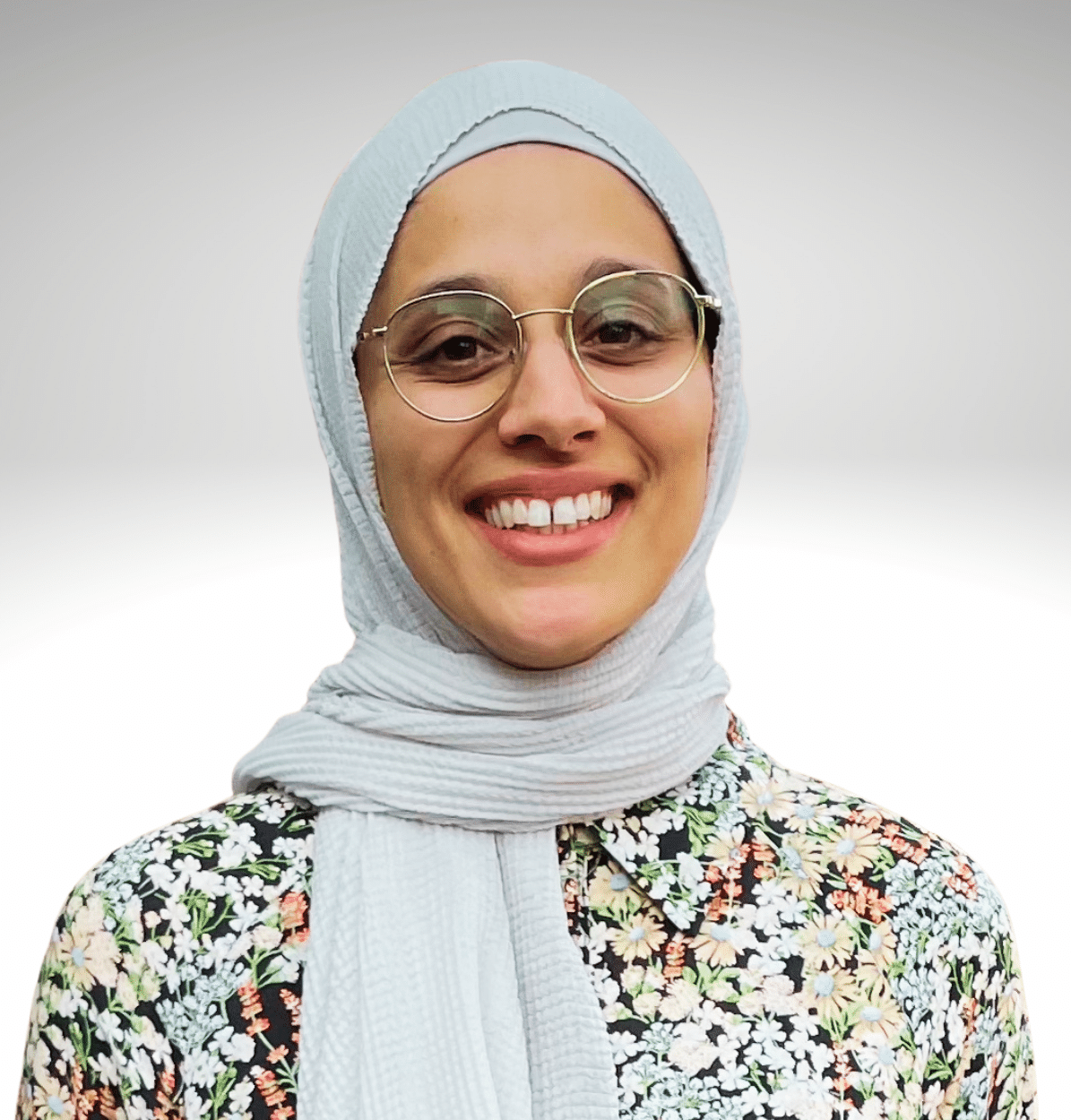 Atty. Sophia Akbar wearing flower print shirt and white hijab.